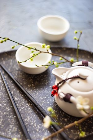 Asian style tea set with floral branches