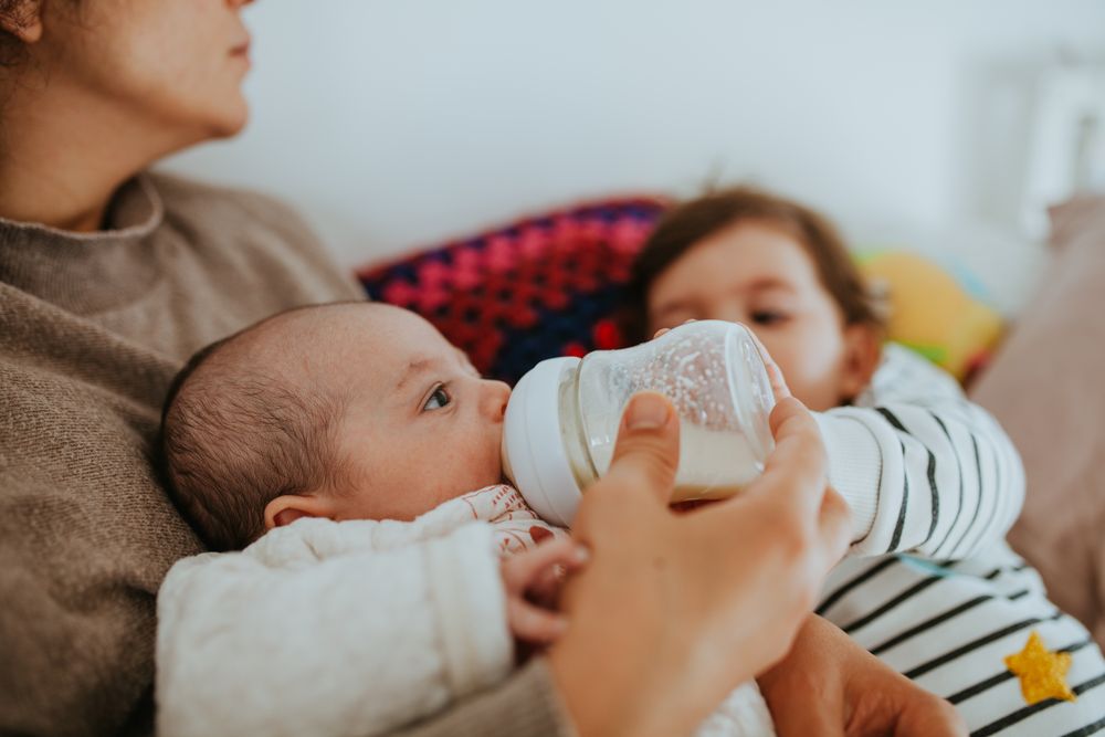 Baby being bottle fed