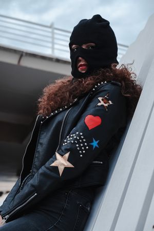 Woman in balaclava and leather jacket