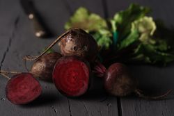 Bunch of raw beetroot with edible taproots and leaves