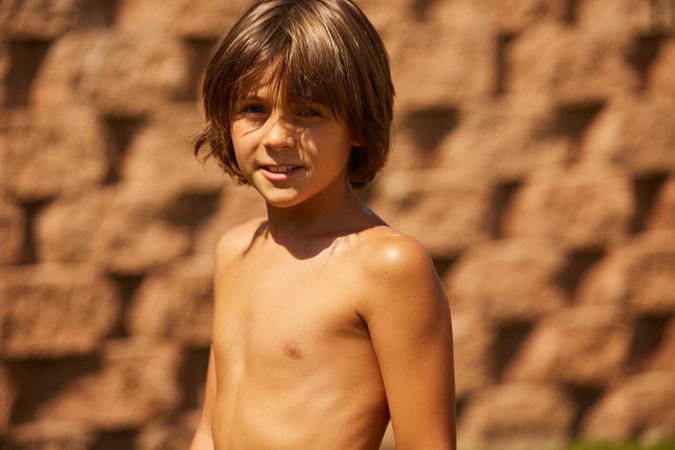 Boy standing and looking at the camera