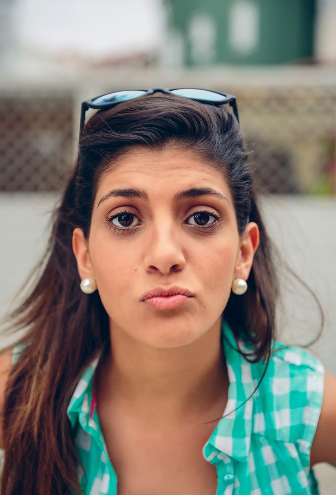Woman blowing kiss at camera