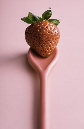 Single strawberry on a spoon