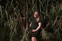 Pregnant woman standing in garden