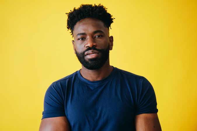 Portrait of Black man in navy t-shirt in studio shoot