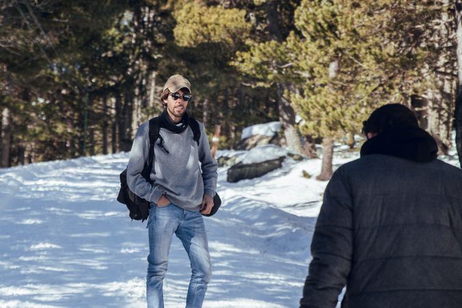 Man waiting male in winter forest