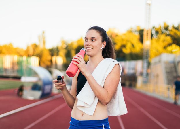 An athletic woman resting after running.