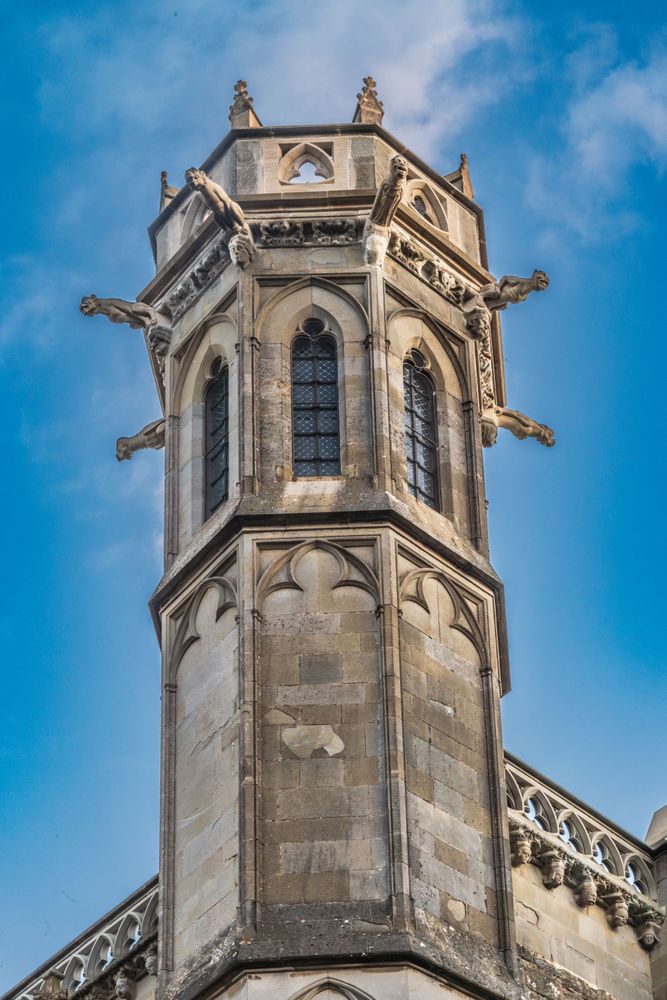 Tower of the church of Saint Nazaire in the historic fortification castle of Carcassonne. A tall building with a pointed top and a window on the top