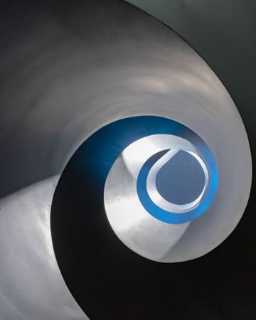 Silver and blue spiral paint shape