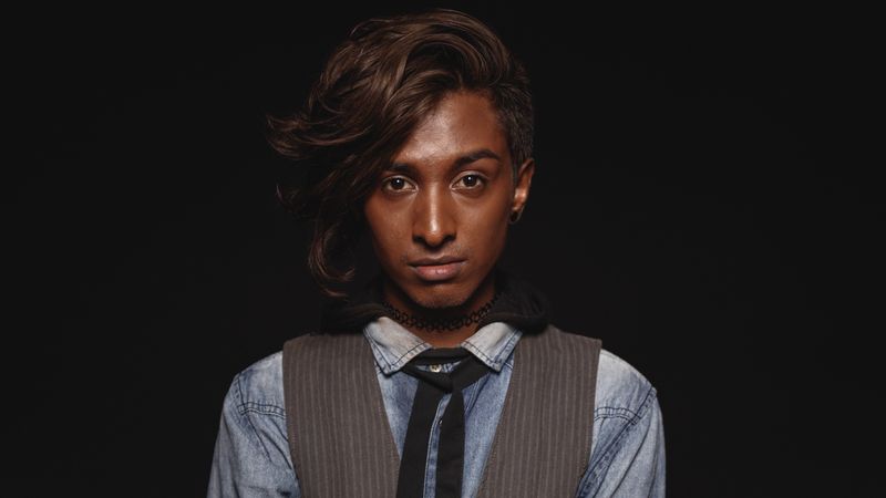 Fashionable Indian male isolated on dark background