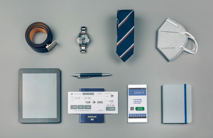Set with mobile covid passport and businessman trip accessories