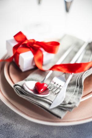 Valentine's Day red themed dinner setting with heart shaped plate