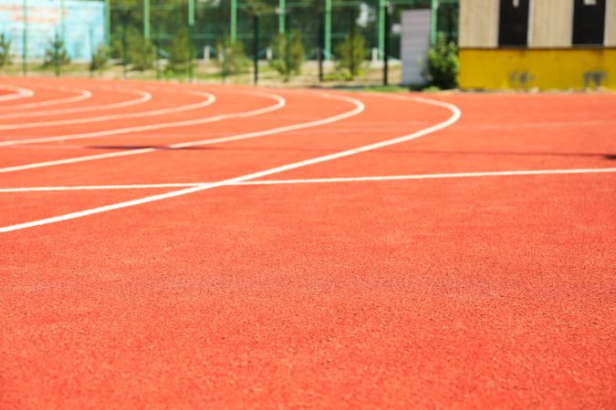 Red running track with lines outdoor, copy space