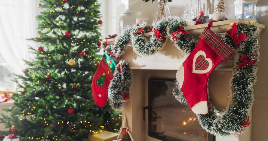 Decorated Corner in Modern House with Christmas Tree, Fireplace and Gifts. Home of a Family Celebrating with Joy