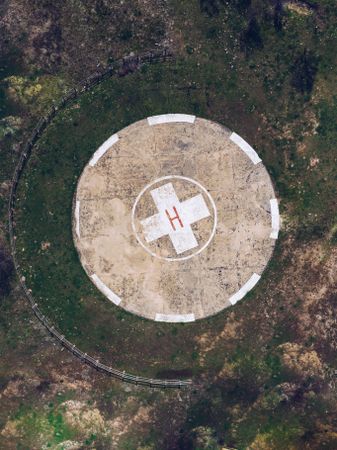 Modern round helipad in green suburbs