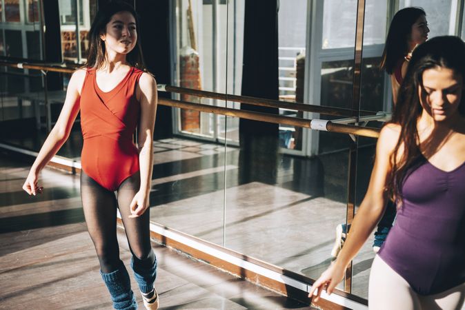 Young dancers of ballet in studio