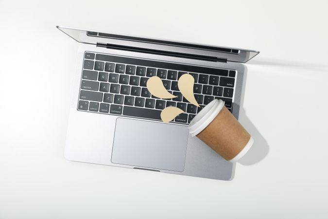Top view of laptop with mock spilled coffee