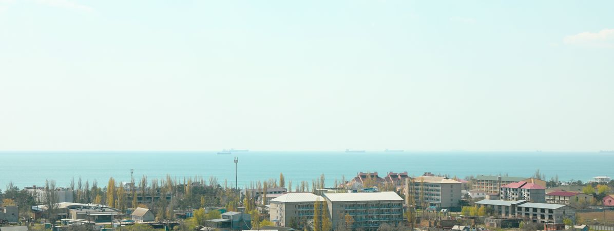 Resort town panorama against blue sea. Amazing spring weather