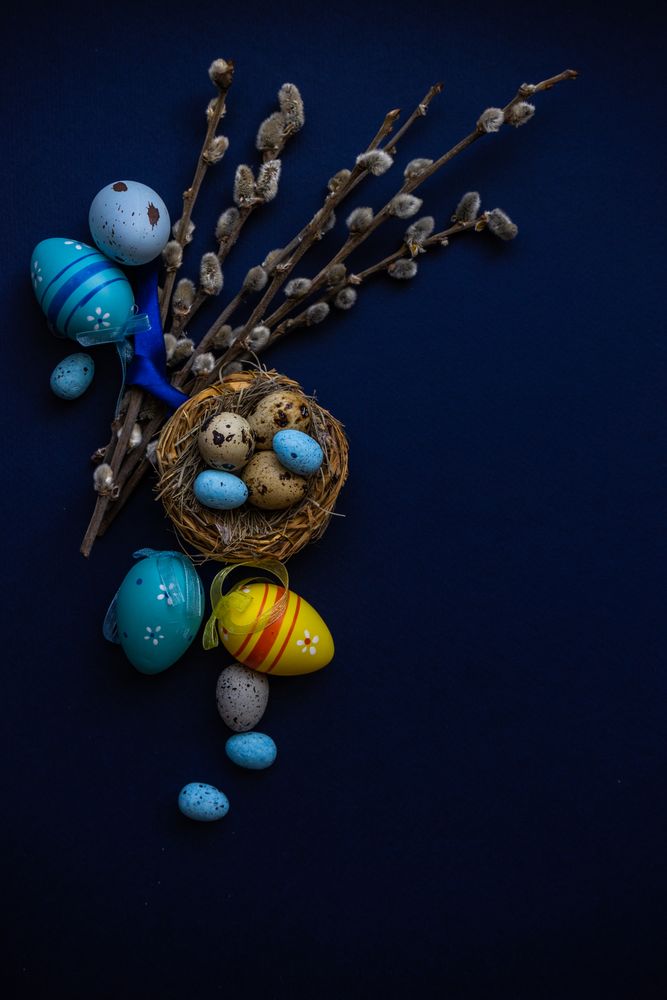 Top view of blue table and bird's nest for Easter card concept