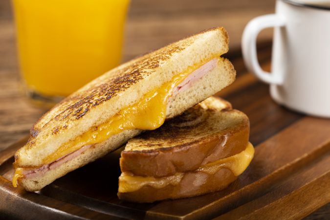 Grilled ham and cheese. Sandwich with cheese and ham on grill.