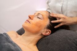 Woman receiving treatment in spa