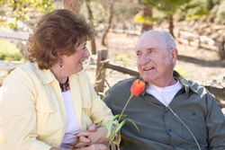 Mature Woman with Man Wearing Oxygen Tubes