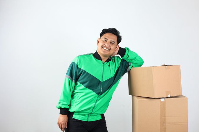 Asian Online Driver Lean on Box, Gojek Grab Delivery Concept