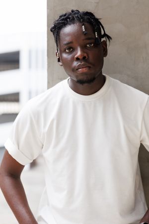 Portrait of young Black male looking at camera
