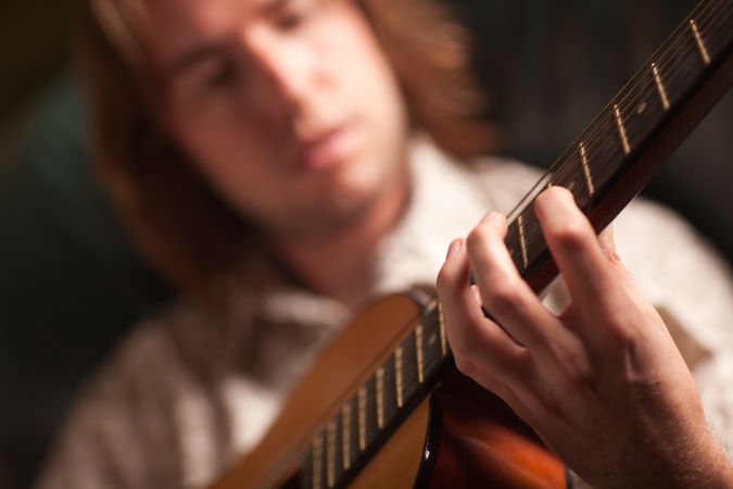Young Musician Plays His Acoustic Guitar