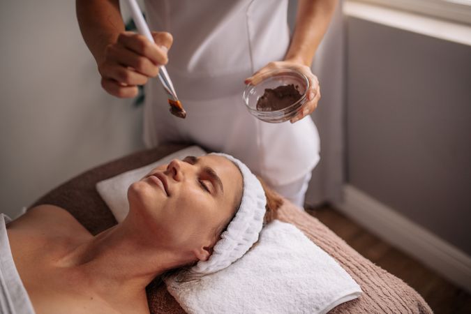 Woman having spa procedure on her face
