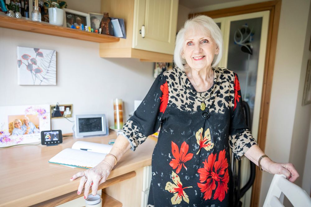 Woman standing up from desk