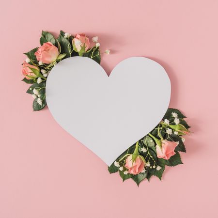 Heart shape paper card note with natural spring wild flowers