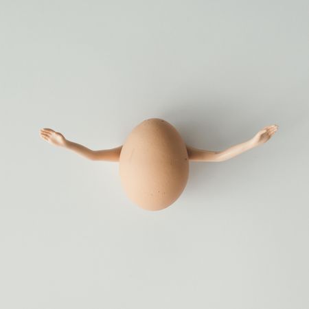 Egg with outreached arms