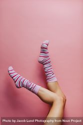 Woman feet in multicolored striped socks bYqK6G