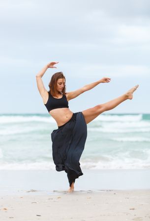 woman dancing near sea