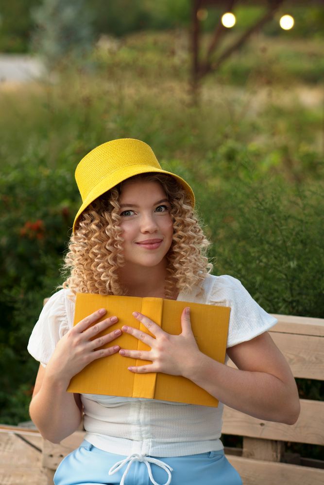 Woman with book outdoors