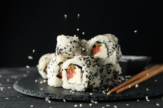 Tray with delicious sushi rolls, close up. Japanese food