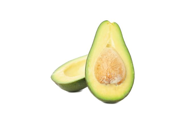 Ripe avocado halves isolated on blank background