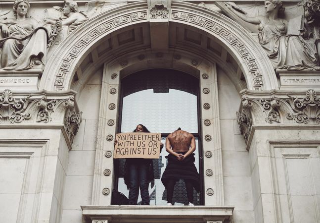 London, England, United Kingdom - June 6th, 2020: Two protesters standing in arch