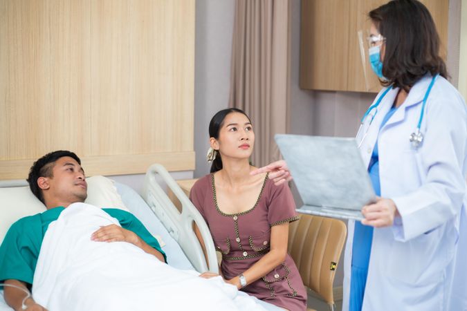 Wife talking care with husband in hospital