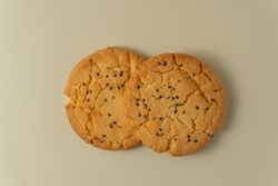 Sesame topped cookies arranged neatly