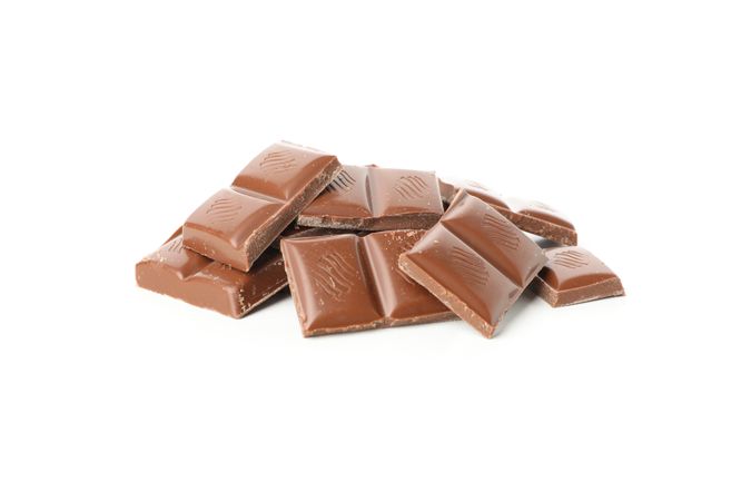 Tasty chocolate pieces isolated on blank background