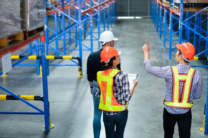 Multi-ethnic group of colleagues checking stock in the distribution center