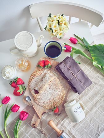 Delicious tasty homemade crepes on kitchen desk