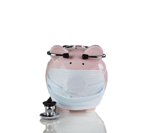 Financial bad times with medical equipment on piggy bank