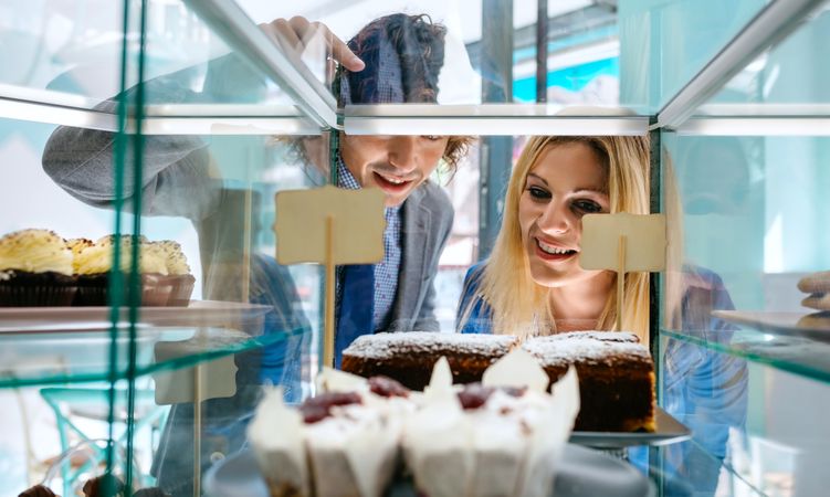 Couple choosing a cake