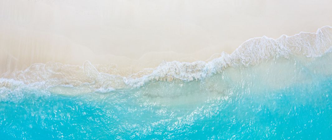 Wide aerial shot of tropical beach