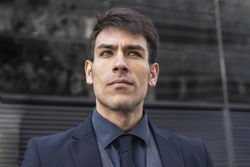 Low-angle view of an executive man looking away.