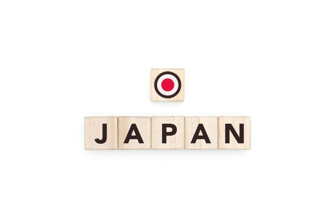 Wooden blocks bearing the name and flag of Japan.