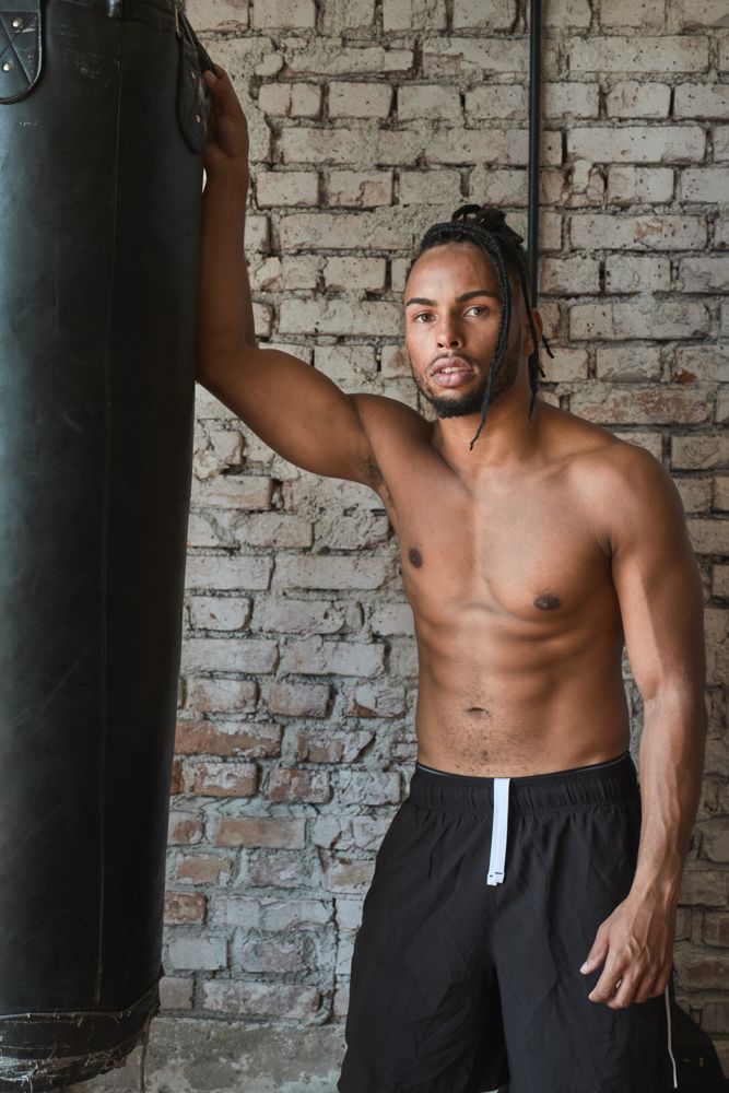 Confident Black boxer in gym